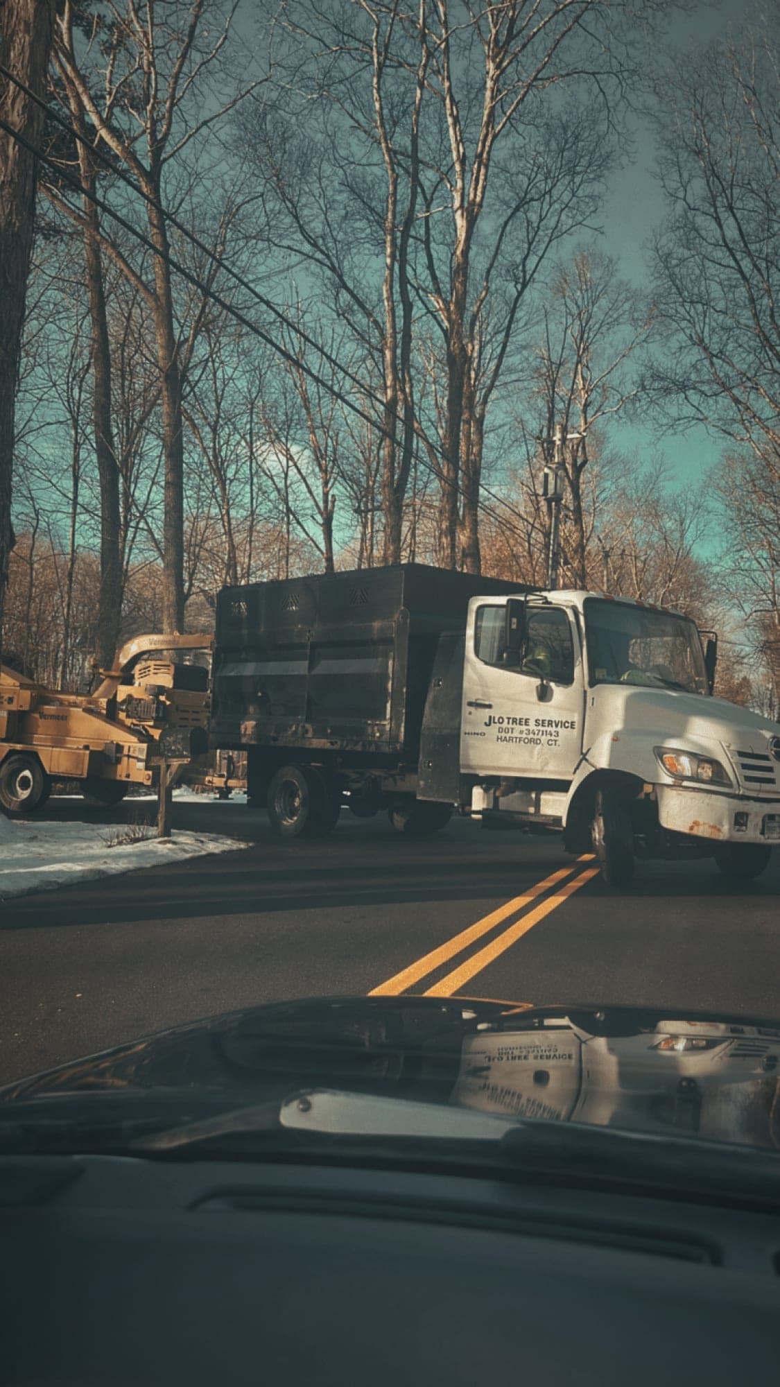 JLO chip truck and chipper on the road at a winter job