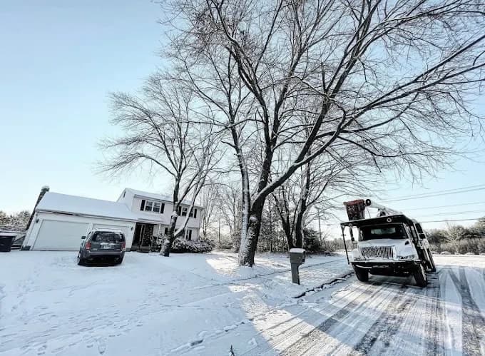 JLO bucket truck on a snowy street