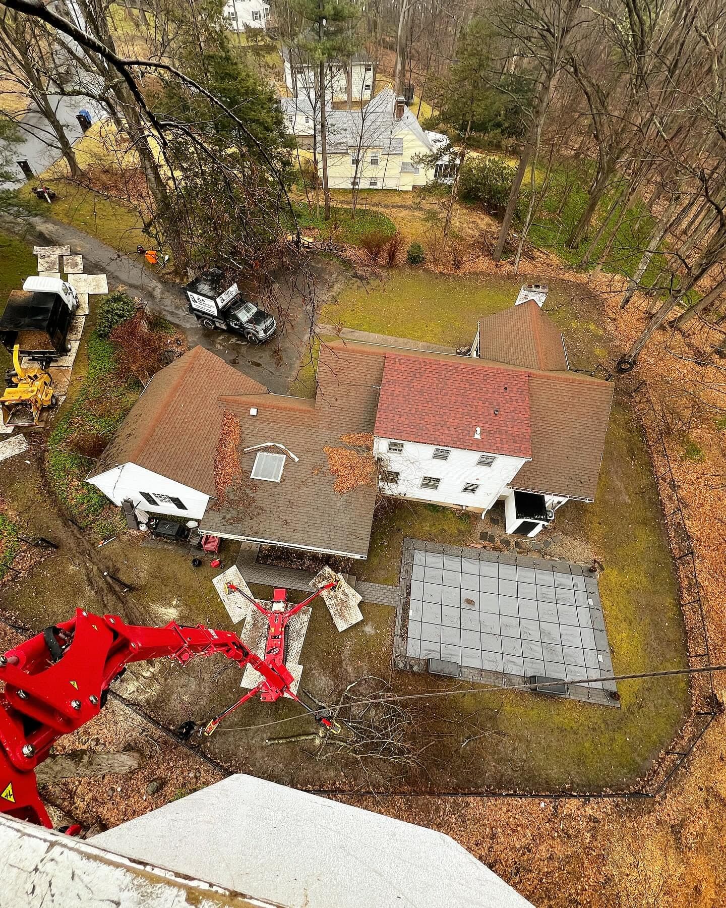 Aerial view from a spider lift over a house and yard during a tree job
